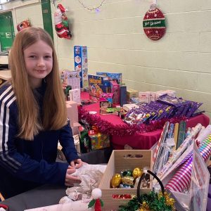Slough Young Carers Gifts of Gratitude event helping carers to pick a gift for a loved one.